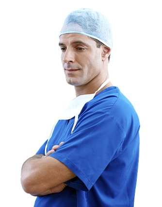 Male doctor in operating clothes with arms crossed